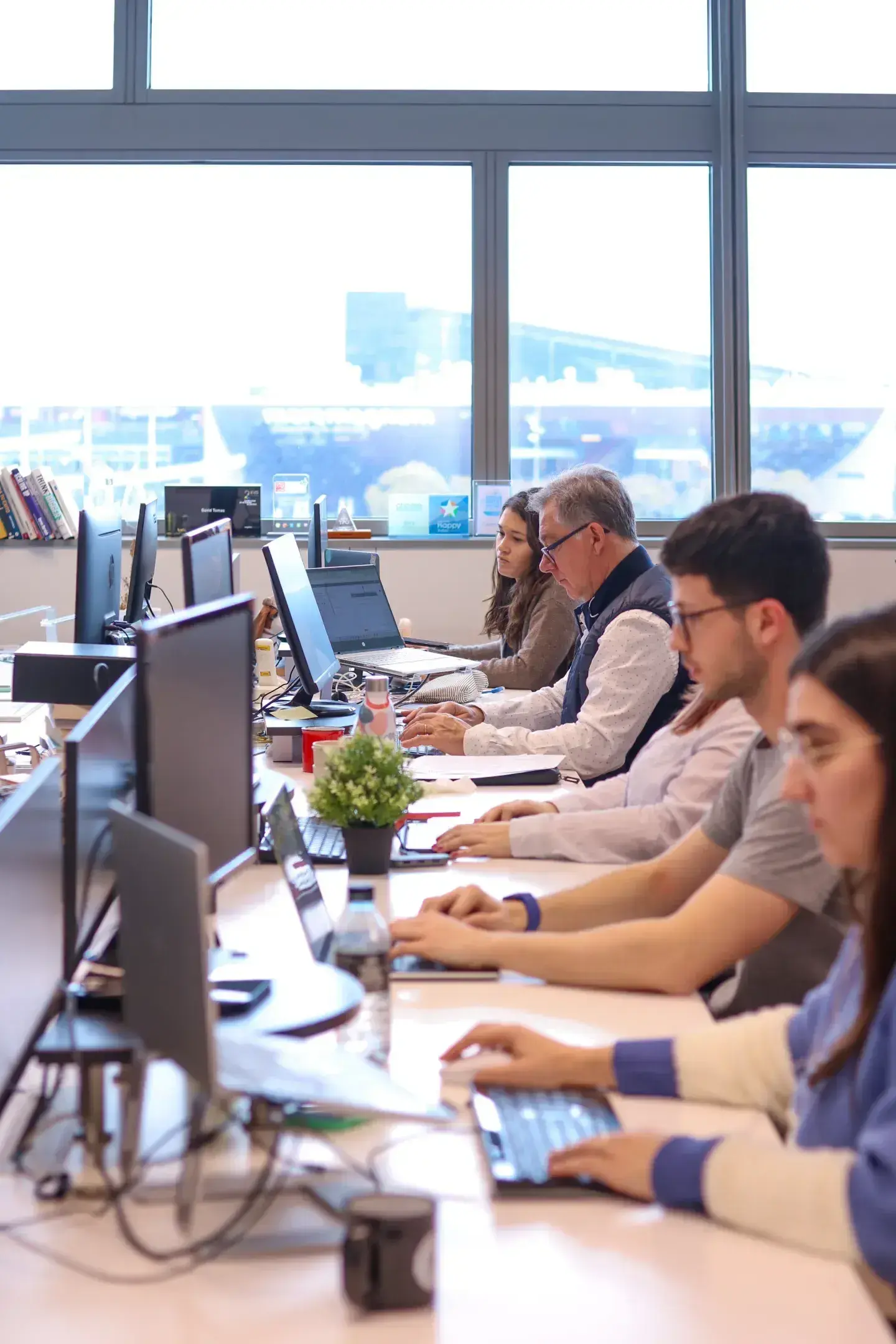A group of Cyberclick employees working at their desks