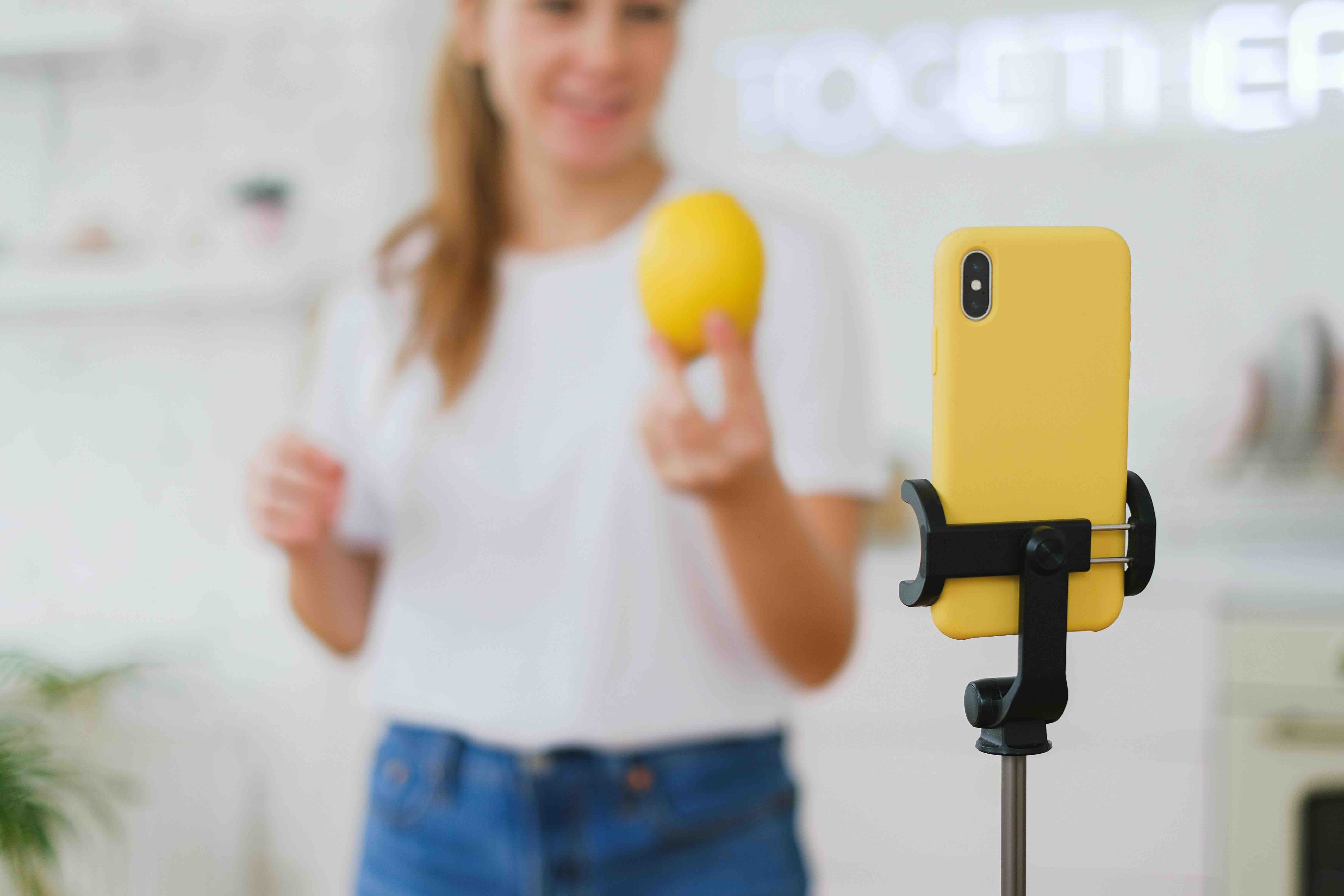 An influencer in front of her mobile phone