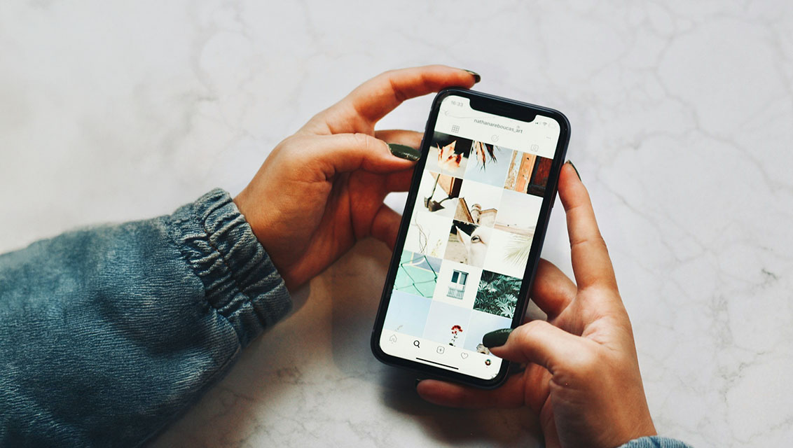 Someone looking at Instagram on their mobile phone